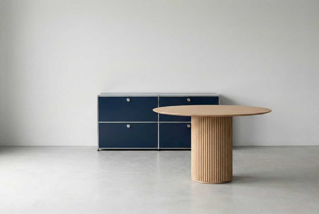 a round table with a textured cylindrical base and a modular cabinet with clean rectangular sections